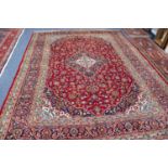 KASHAN PERSIAN CARPET with lozenge shaped centre triple concentric medallion with pendants, on a