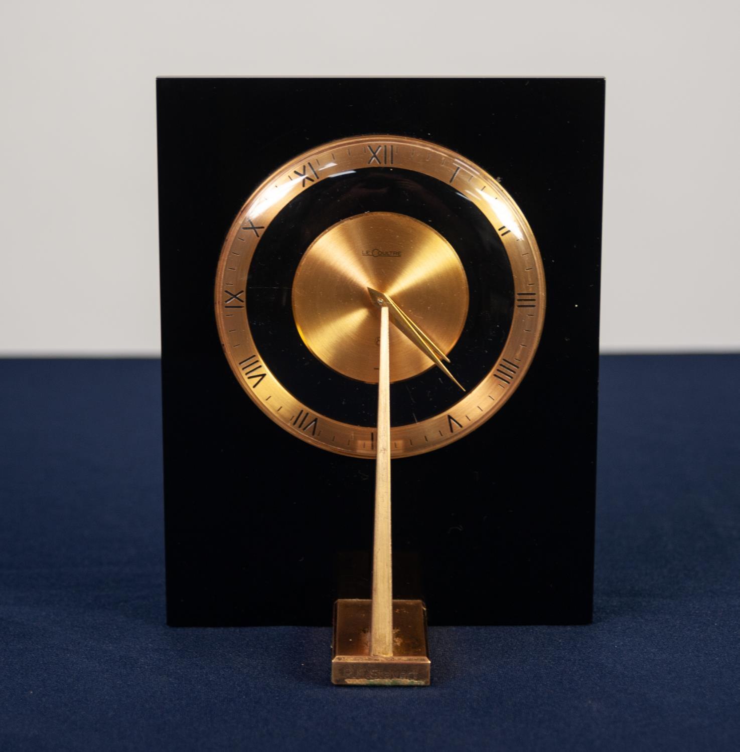 UNUSUAL AND RARE, CIRCA 1970, JAEGER LE COULTRE BLACK PERSPEX AND BRASS DESK CLOCK of sundial form - Image 2 of 3