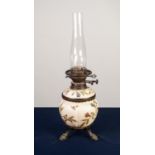 VICTORIAN GILT METAL MOUNTED BLUSH PORCELAIN OIL TABLE LAMP, the lobated reservoir painted in