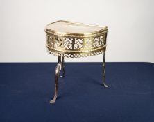 NINETEENTH CENTURY BRASS 'D' SHAPED FOOTMAN KETTLE STAND,  with deep shell pierced apron with reel