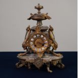 EARLY TWENTIETH CENTURY GILT METAL MANTLE CLOCK, the twelve piece porcelain Roman dial powered by