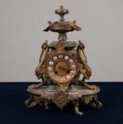 EARLY TWENTIETH CENTURY GILT METAL MANTLE CLOCK, the twelve piece porcelain Roman dial powered by