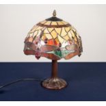 MODERN TIFFANY STYLE TABLE LAMP, the patinated base moulded with leaves, beneath a domed and
