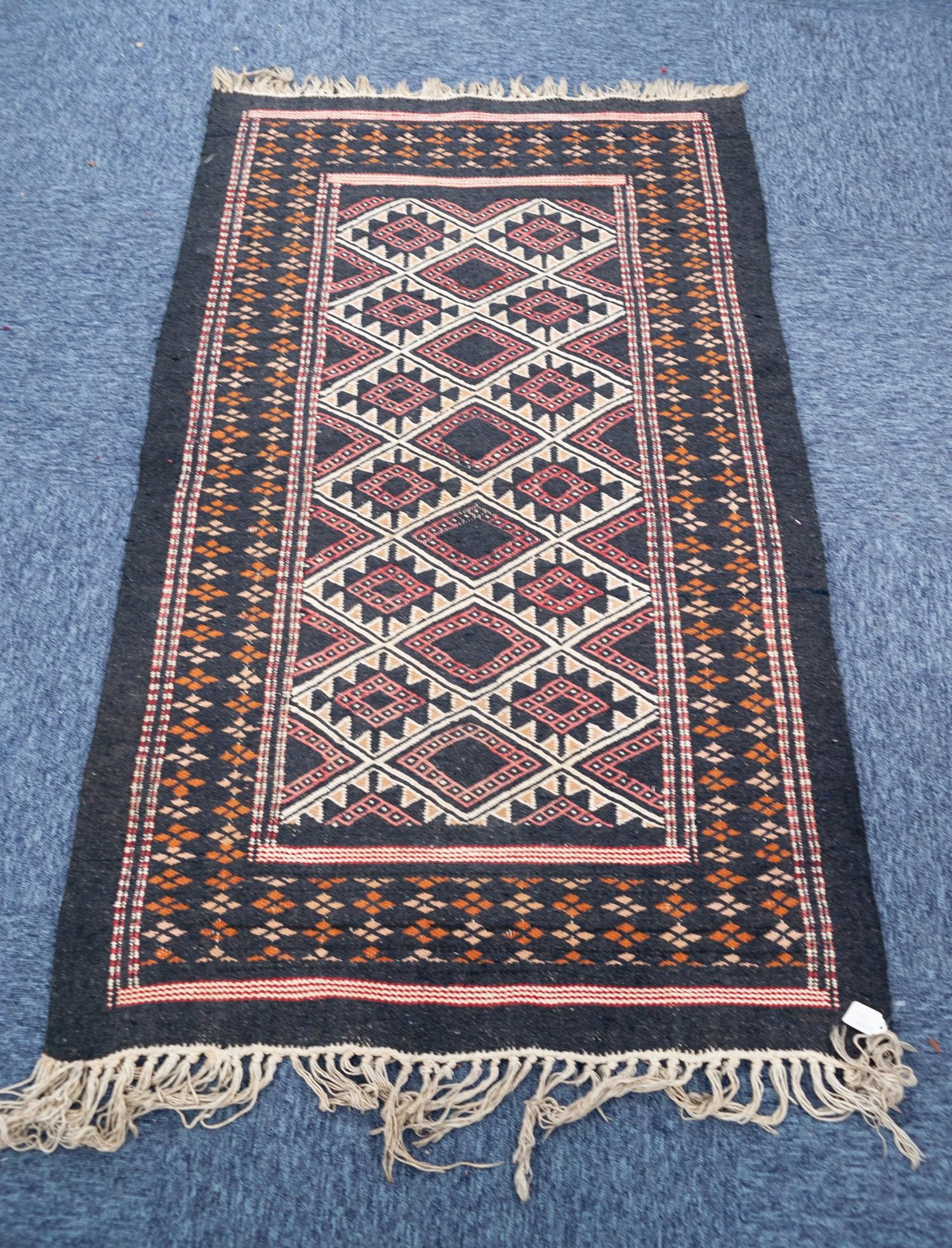 EASTERN KELIM RUG, with predominantly red and black all over diamond pattern, the principal border - Image 2 of 2