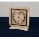 ELLIOTT WHITE ONYX AND GILT METAL MANTLE CLOCK, square, with in-turned corners and oblong base,
