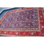 TABRIZ PERSIAN CARPET with all-over repeat formal floral, leaf and ram's horn patetrn on a dark blue