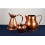 SEAMED COPPER HARVEST JUG, 11 ½? (29.2cm) high, together with a LARGER COPPER JUG, of bellied form