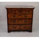 ANTIQUE FIGURED WALNUT AND OAK CHEST OF DRAWERS WITH WHITE VEINED MARBLE TOP, the caned oblong top