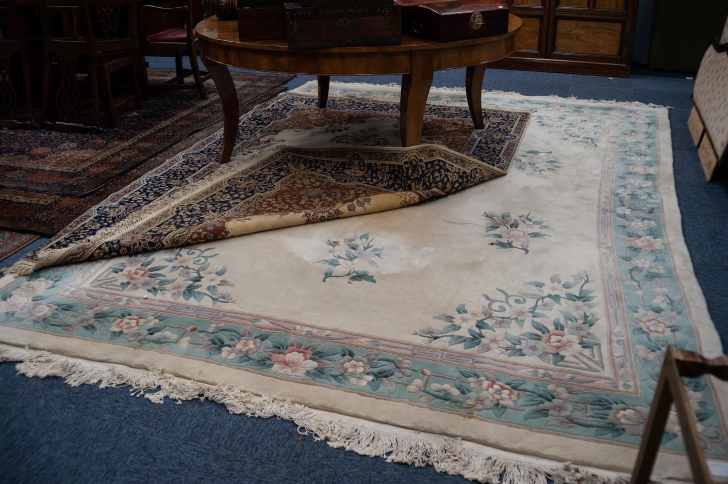 CHINESE EMBOSSED CARPET, with floral design and spandrels on an ivory field, pale blue and floral