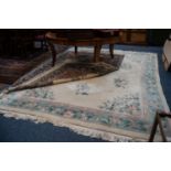 CHINESE EMBOSSED CARPET, with floral design and spandrels on an ivory field, pale blue and floral