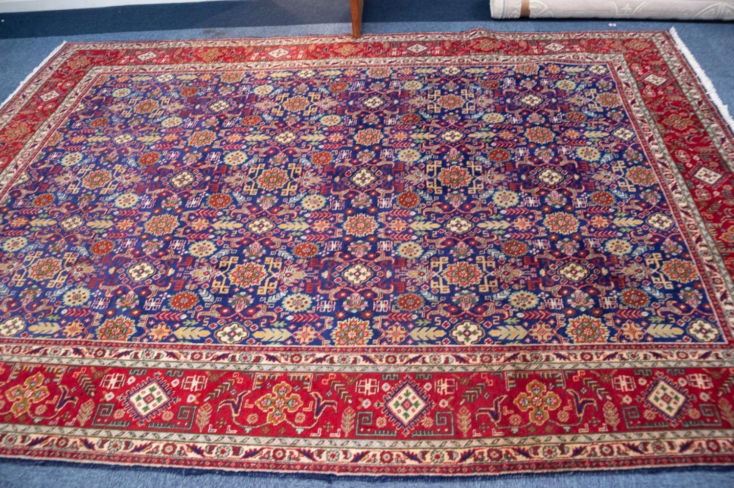 TABRIZ PERSIAN CARPET with all-over repeat formal floral, leaf and ram's horn patetrn on a dark blue - Image 3 of 3