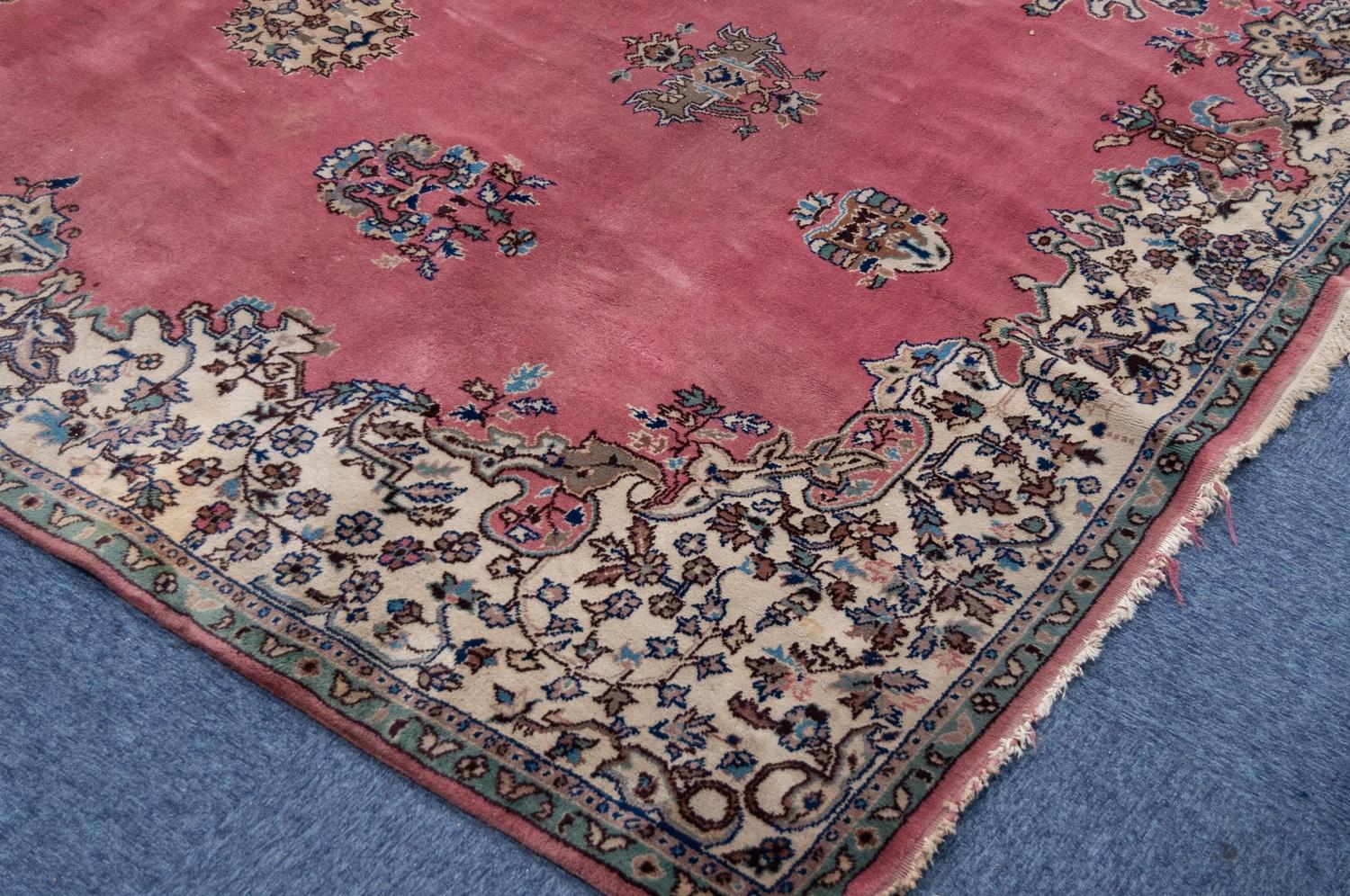 LARGE, POSSIBLY EUROPEAN, PERSIAN STYLE CARPET, having a rose pink field, large green, brown and - Image 2 of 3