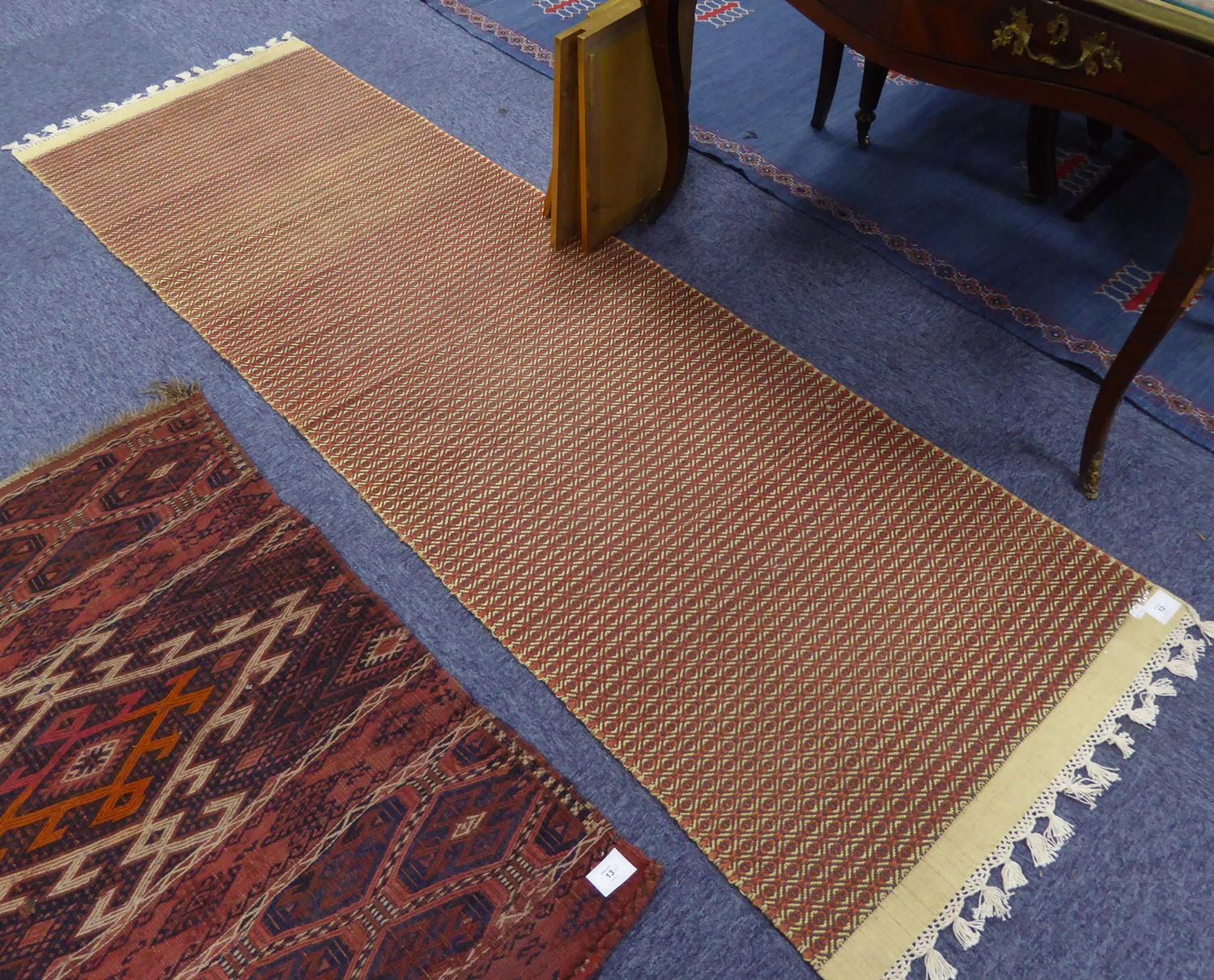 EASTERN KELIM SMALL CARPET, with centre brick red diamond shaped medallion on a plain blue field