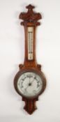 LATE VICTORIAN CARVED OAK ANEROID BAROMETER, the 8? dial set beneath a mercury thermometer to the