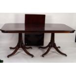 MODERN REPRODUCTION MAHOGANY DINING TABLE, WITH EXTRA LEAF, AND SET OF TEN SINGLE DINING CHAIRS, the