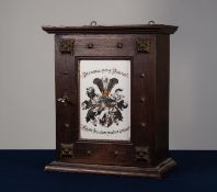 EARLY TWENTIETH CENTURY GERMAN DARK OAK AND MILK GLASS SMALL MURAL CABINET, the moulded cornice