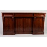 EARLY NINETEENTH CENTURY FIGURED MAHOGANY SIDEBOARD, the moulded oblong top above three concave