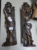 A PAIR OF PRE-WAR OXYIDISED CAST IRON FIREPLACE ORNAMENTS/ATTACHMETS IN THE FORM OF CLASSICAL DRAPED