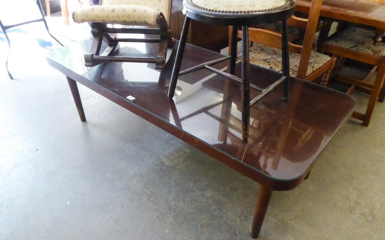 A LARGE OBLONG MAHOGANY COFFEE TABLE WITH QUADRANT CORNERS, ON POST SUPPORTS, 5? X 2?2? , WITH PLATE