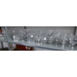 LARGE QUANTITY OF DRINKING GLASSES TO INCLUDE; WINES, TUMBLERS, CHAMPAGNE, ETC... (APPROX 90 PIECES)