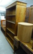 * A LARGE GOOD QUALITY PINE OPEN BOOKCASE, HAVING FIVE ADJUSTABLE SHELVES AND A TONGUE AND GROOVE