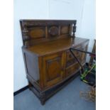 OAK CARVED SIDEBOARD, HAVING THREE CENTRAL DRAWERS AND CUPBOARD DOORS WITH CANOPY BACK