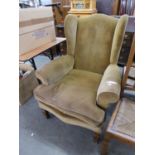 A GOOD QUALITY WING BACK ARMCHAIR, IN THE STYLE OF HOWARD AND SONS