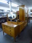 A LIGHT OAK BEDROOM SUITE OF THREE PIECES, CONSISTING OF A SINGLE DOOR WARDROBE, WITH OVAL MIRROR, A