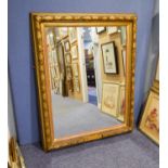 A LARGE UPRIGHT WALL MIRROR, IN FRUITING VINE EMBOSSED FRAME, 4'6" HIGH (SMALL SECTION OF FRAME