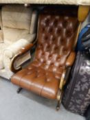 A REPRODUCTION BROWN LEATHER UPHOLSTERED REGENCY  REVIVAL CHAIR (BOTH BACK LEGS HAVING BEEN