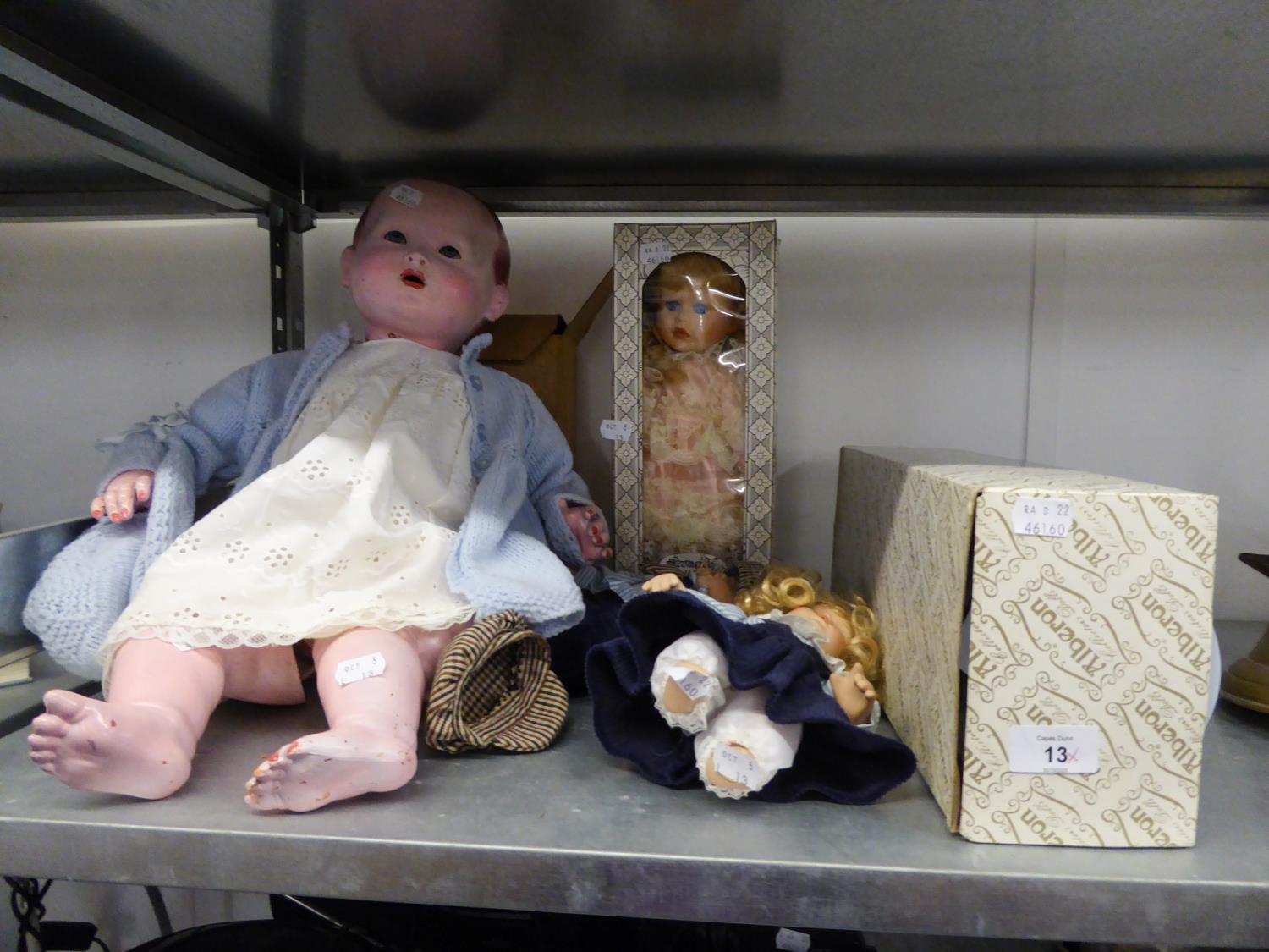 A LARGE COMPOSITION BABY DOLL WITH SLEEPING EYES, DRESSED (TORTOISE TRADE MARK) AND FOUR MODERN