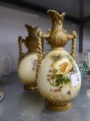 A PAIR OF AUSTRIAN CHINA TWO HANDLED VASES PAINTED WITH FLOWERS ON AN IVORY GROUND (ONE AS FOUND)