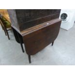 * A MAHOGANY DROP-LEAF DINING TABLE