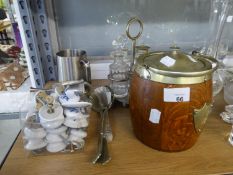 AN OAK BISCUIT BARRELL WITH METAL MOUNTS AND LID; AN ELECTROPLATE CRUET FRAME WITH FOUR CUT GLASS