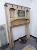 STRIPPED PINE ART NOUVEAU STYLE LARGE FIRE SURROUND HAVING FANCY GLASS PANEL TO DOOR