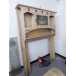 STRIPPED PINE ART NOUVEAU STYLE LARGE FIRE SURROUND HAVING FANCY GLASS PANEL TO DOOR