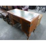 A DYNATRON WALNUT AND MAHOGANY CROSSBANDED RADIOGRAM, IN THE FORM OF A PEDESTAL DESK WITH GREEN