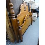 A MODERN CARVED PINE 4?6? PANEL BEDSTEAD, WITH SLATTED WOOD BASE