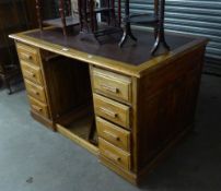 A MID-CENTURY MAHOGANY TWIN PEDESTAL DESK