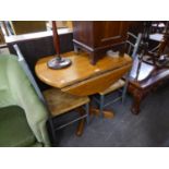 A CIRCULAR DINING TABLE, ON COLUMN AND FOUR SPUR BASE AND A PAIR OF GREY METAL SINGLE CHAIRS WITH