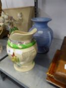 CROWN DEVON POTTERY MUSICAL JUG ?ON ILKLA MOOR BAHT?AT? AND AN ART DECO PALE BLUE TWO HANDLED RIBBED