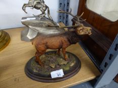 'COUNTRY ARTISTS' RESIN MODEL OF A STAG, ON WOODEN OVAL BASE