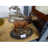 'COUNTRY ARTISTS' RESIN MODEL OF A STAG, ON WOODEN OVAL BASE