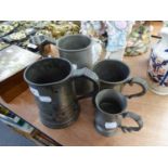 TWO ANTIQUE PERWTER QUART TANKARDS, AN ANTIQUE PEWTER PINT TANKARD AND A PEWTER HALF PINT TANKARD (