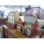 TWO DOLLS HOUSES AND A LEATHER SUITCASE (3)