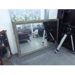 A LARGE OBLONG BEVELLED EDGE WALL MIRROR IN EBONISED GILT FRAME, 5?4? WIDE