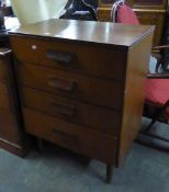 A STYLISH TEAK CHEST OF FOUR DRAWERS