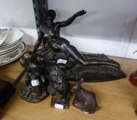 A MODERN BRONZED RESIN NUDE RECLINING FEMALE FIGURE AND TWO SMALL ORNAMENTS, 'THE KISS' AND AN '