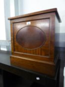A MAHOGANY SMALL SQUARE COAL RECEIVER OR SLIPPER BOX WITH OVAL PANEL FRONT