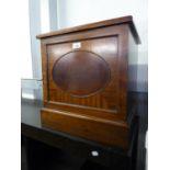A MAHOGANY SMALL SQUARE COAL RECEIVER OR SLIPPER BOX WITH OVAL PANEL FRONT
